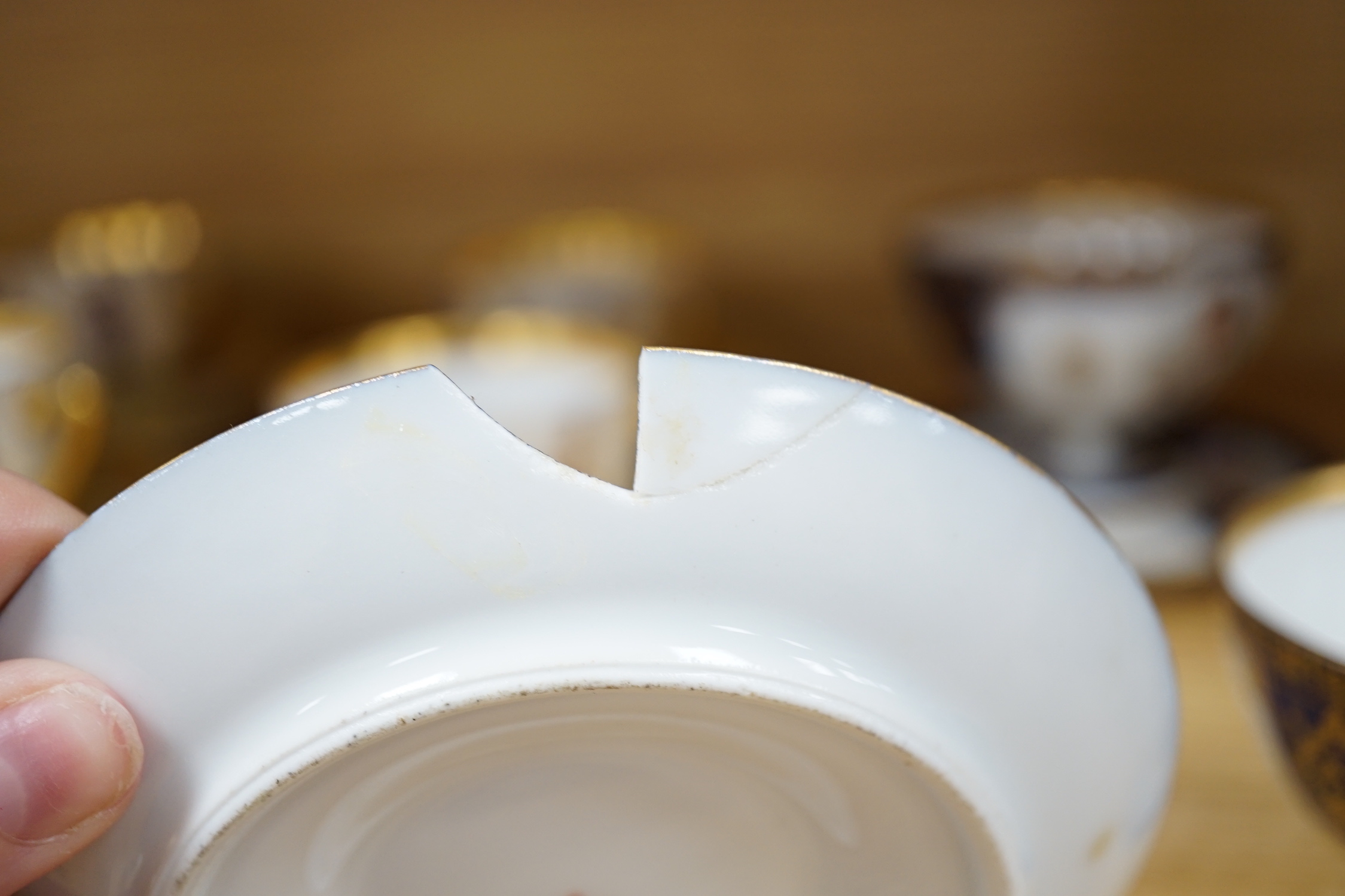 A group of European porcelain tableware to include a pair of figures, Lowestoft jug, Dresden cups etc.